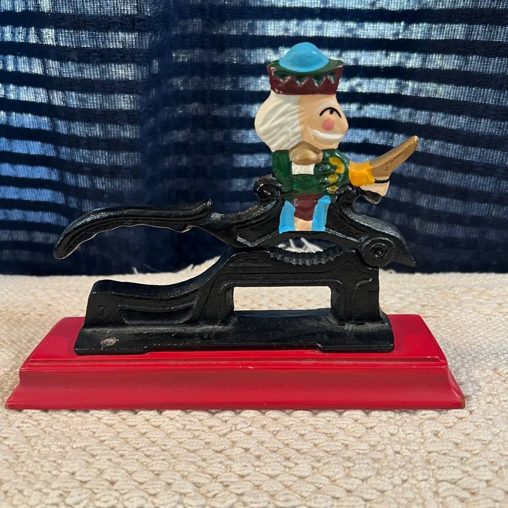 Vintage Cast Iron Nutcracker on‎ Red Wood Base Hand Painted Decor